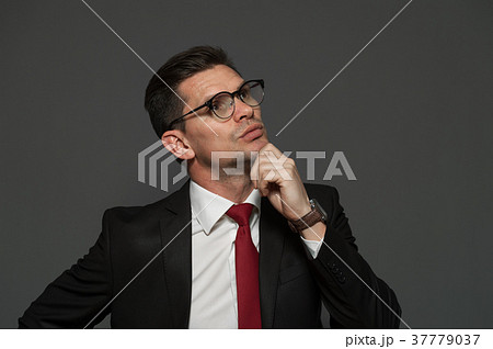 Cute businessman posing indoors Cute businessman posing indoors 37779037