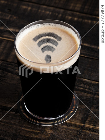 Glass of stout beer top with wi-fi symbol shape 37779974