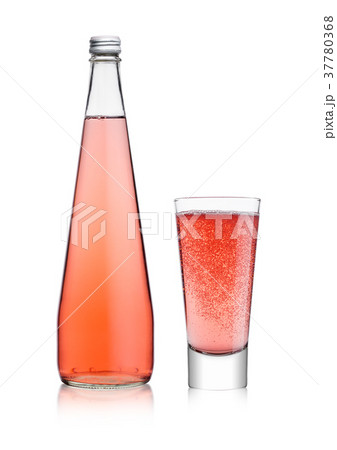 Bottle and glass of sparkling pink soda lemonade 37780368