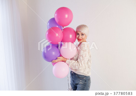 blonde girl with balloons and gifts for holiday blonde girl with balloons and gifts for holiday 37780583