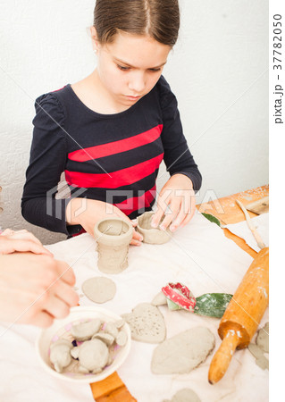Child hands with plasticine 37782050