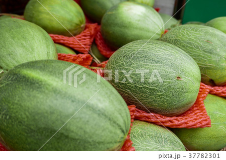 melon placed for sale on booth at market. melon placed for sale on booth at market. 37782301