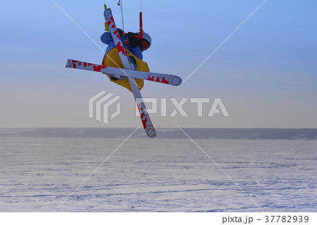 A male athlete engaged in snow kiting 37782939