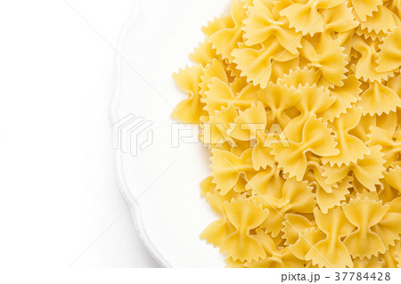 Raw fresh farfalle isolated on white Raw fresh farfalle isolated on white 37784428