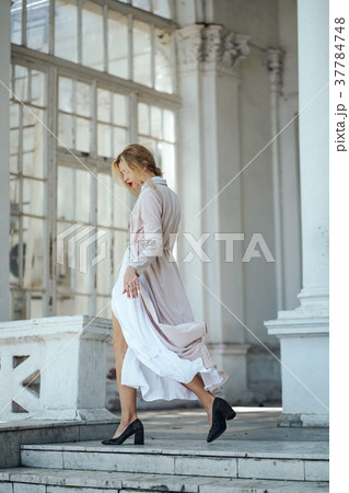 Girl is posing on the city street Girl is posing on the city street 37784748