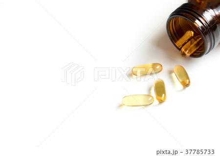 Yellow soft gelatin capsule with amber bottle Yellow soft gelatin capsule with amber bottle 37785733