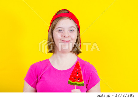 Girl Down syndrome with large Lollipop 37787295