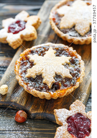 Cakes with dried fruits, orange jam and nuts. 37789457