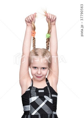 Girl is holding her pigtails Girl is holding her pigtails 37790563
