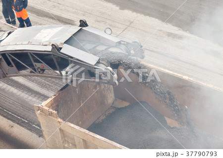 Road works. Asphalt removing machine loading Road works. Asphalt removing machine loading 37790793