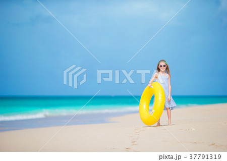 Adorable girl with inflatable rubber circle on Adorable girl with inflatable rubber circle on 37791319