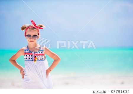 Portrait of little girl on the beach Portrait of little girl on the beach 37791354