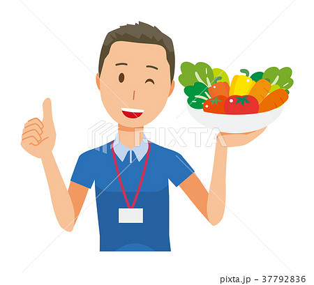 ネームプレートを着用している男性スタッフが野菜を持っている 37792836