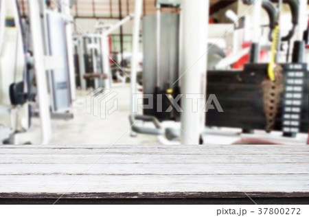 Wooden table on blurred background of fitness gym interior of mo 37800272