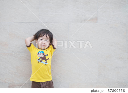 Closeup cute asian kid standing poses Closeup cute asian kid standing poses 37800558
