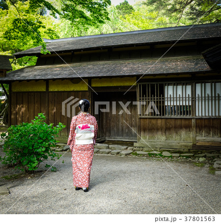 A woman in kimono at old village in Japan 37801563
