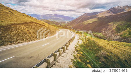 Winding empty road on the mountain Winding empty road on the mountain 37802461