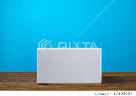 Empty Package white cardboard box on wood table 37803657