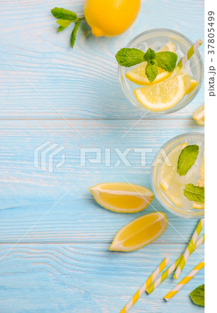Cold refreshing summer drink with lemon and mint. 37805499