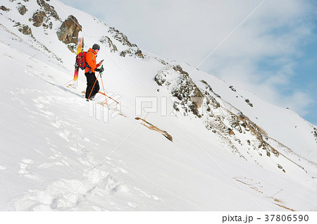 a ski freerider standing on a slope into a deep a ski freerider standing on a slope into a deep 37806590