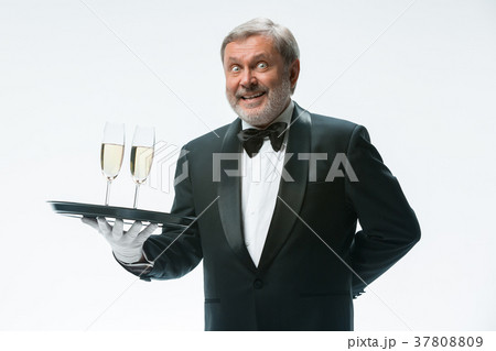professional waiter in uniform is serving wine 37808809