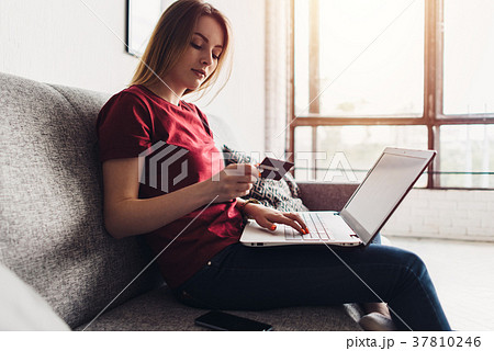 Online payment, woman holding credit card and 37810246