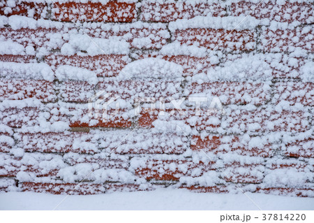 snow wall of red brick.background snow wall of red brick.background 37814220