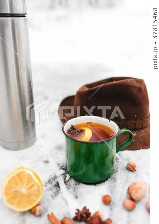 tea with lemon and cardamom on the background  37815468