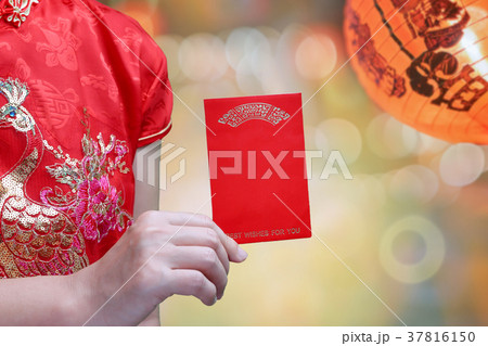 woman holding new year red envelope or hong bao woman holding new year red envelope or hong bao 37816150
