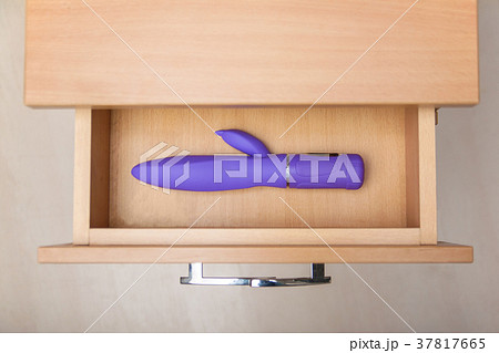 Sex toy in open countering bedside table 37817665