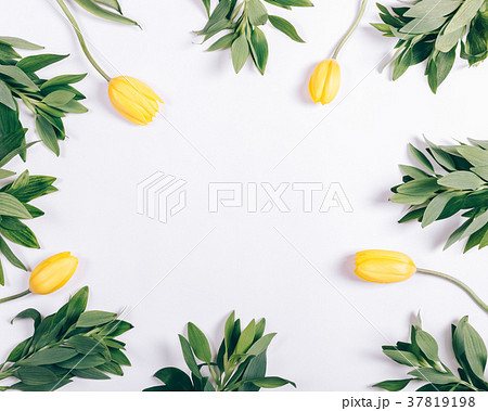 Yellow tulips on white table with place for text 37819198