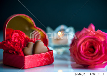 Red heart-shaped box with chocolate hearts Red heart-shaped box with chocolate hearts 37819694