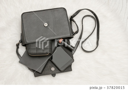 Open black bag with dropped things, notebook 37820015