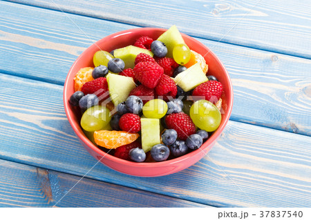 Fresh prepared fruit salad in glass bowl Fresh prepared fruit salad in glass bowl 37837540