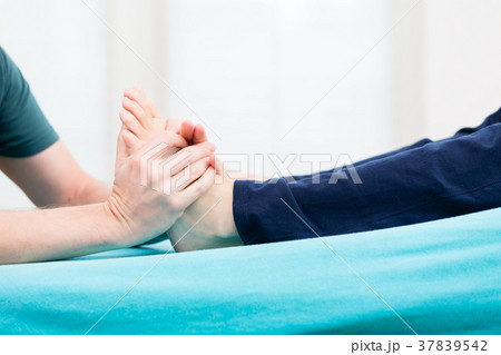 Patient having foot massage at physio 37839542