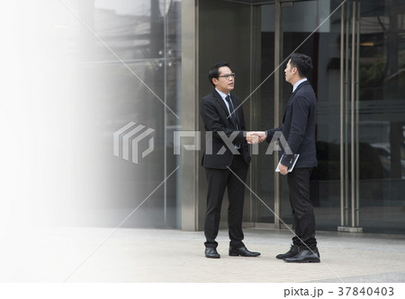 Businessman making handshake agreement. Businessman making handshake agreement. 37840403