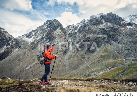 Young woman hiking in the mountains Young woman hiking in the mountains 37843246