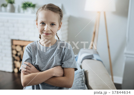 Content girl standing with her hands crossed 37844634