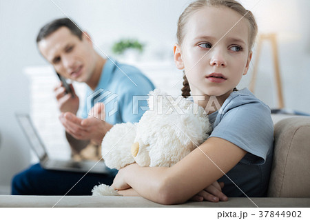 Sad little girl crying and holding her toy Sad little girl crying and holding her toy 37844902