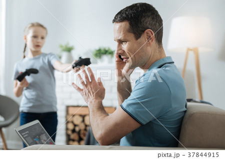 Busy man having no time on playing with daughter 37844915
