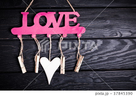 Red wooden word LOVE on wood backdrop Red wooden word LOVE on wood backdrop 37845390