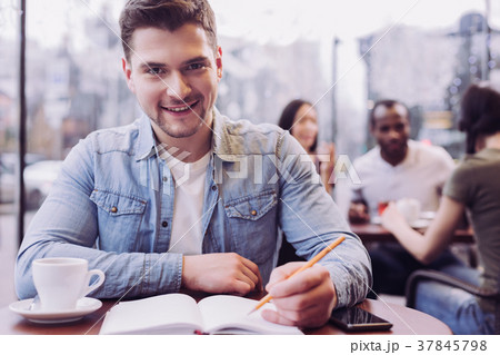 Attractive male student preparing for exams Attractive male student preparing for exams 37845798