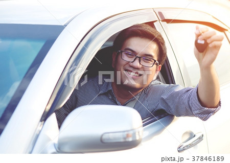 excited young man showing a car  37846189