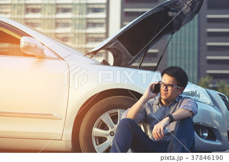 Angry man Stand front a broken car calling  37846190