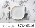 White Plate on white wooden background  37846316