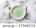 Green Plate on white wooden background  37846319