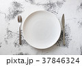 White Plate on white wooden background  37846324