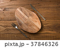 Oval cutting board with knife and fork  37846326