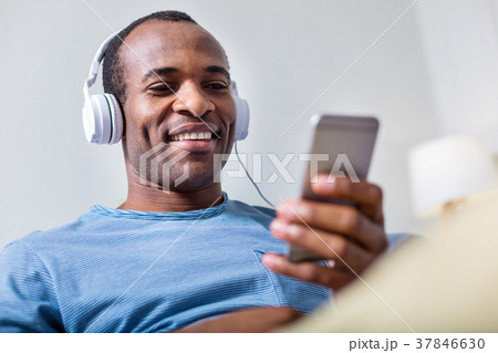 Cheerful happy man enjoying the music 37846630
