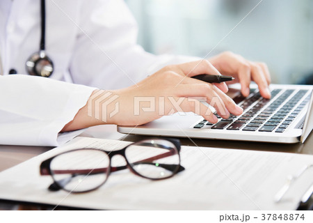 Female Doctor working with laptop. 37848874